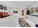 Bright bedroom with a king-size bed and access to the bathroom at 1006 S Riverside Dr, Edgewater, FL 32132