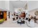 Open living area with a curved sofa and views to the backyard at 1006 S Riverside Dr, Edgewater, FL 32132