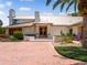 Home's entryway with double doors and manicured landscaping at 1006 S Riverside Dr, Edgewater, FL 32132