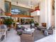 Relaxing outdoor patio with comfortable seating and fireplace at 1006 S Riverside Dr, Edgewater, FL 32132