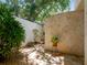 Private courtyard with stone walls and lush landscaping at 1006 S Riverside Dr, Edgewater, FL 32132