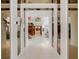 Modern entryway with high ceilings, wood staircase, and art at 1006 S Riverside Dr, Edgewater, FL 32132