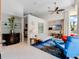 Bright and airy living room with comfortable seating and a large TV at 1006 S Riverside Dr, Edgewater, FL 32132