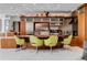 Modern kitchen with a curved breakfast bar and wood cabinetry at 1006 S Riverside Dr, Edgewater, FL 32132