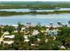 Aerial view of waterfront property with a neighborhood at 1006 S Riverside Dr, Edgewater, FL 32132
