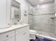 Modern bathroom with a walk-in shower and quartz countertop at 807 S Atlantic Ave # 302, New Smyrna Beach, FL 32169