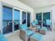 Ocean view balcony with wicker furniture and seating at 807 S Atlantic Ave # 302, New Smyrna Beach, FL 32169