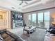 Relaxing living room with leather sofas, a fireplace, and stunning ocean views from sliding glass doors at 807 S Atlantic Ave # 302, New Smyrna Beach, FL 32169
