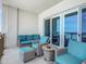 Ocean view balcony with wicker furniture and seating at 807 S Atlantic Ave # 302, New Smyrna Beach, FL 32169