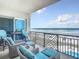 Ocean view balcony with wicker furniture and seating at 807 S Atlantic Ave # 302, New Smyrna Beach, FL 32169