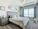 Peaceful main bedroom with a king-size bed, ocean views, and plenty of natural light at 807 S Atlantic Ave # 302, New Smyrna Beach, FL 32169