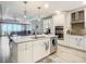 Bright kitchen with island and double ovens at 807 S Atlantic Ave # 302, New Smyrna Beach, FL 32169