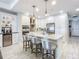 Modern white kitchen with island and stainless steel appliances at 807 S Atlantic Ave # 302, New Smyrna Beach, FL 32169