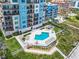 Communal pool area with surrounding deck and landscaping at 807 S Atlantic Ave # 302, New Smyrna Beach, FL 32169