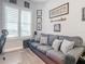 Comfortable sitting area with a sofa and baseball memorabilia at 807 S Atlantic Ave # 302, New Smyrna Beach, FL 32169