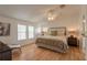 Spacious primary bedroom with a king-size bed and two windows at 4391 Maple Ave, Edgewater, FL 32141