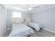 Guest bedroom with two twin beds and a ceiling fan at 632 Goodwin Ave, New Smyrna Beach, FL 32169