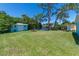 Large backyard with lush grass and a shed at 632 Goodwin Ave, New Smyrna Beach, FL 32169
