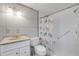 Simple bathroom with white tile, shower, and single vanity at 801 E 24Th Ave, New Smyrna Beach, FL 32169