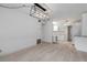 Bright dining area with wood-look tile flooring and a modern light fixture at 801 E 24Th Ave, New Smyrna Beach, FL 32169