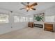 Bright sunroom featuring a fireplace, built-in shelving, and large windows at 801 E 24Th Ave, New Smyrna Beach, FL 32169