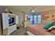 Guest bedroom with white dresser and ocean view at 4139 S Atlantic Ave # B204, New Smyrna Beach, FL 32169