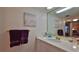Clean bathroom with a large mirror and vanity at 4139 S Atlantic Ave # B204, New Smyrna Beach, FL 32169