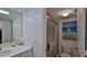 Bathroom featuring a shower, toilet, and beach-themed art at 4139 S Atlantic Ave # B204, New Smyrna Beach, FL 32169