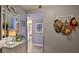 Bright entryway with mirror,hat rack, and small table at 4139 S Atlantic Ave # B204, New Smyrna Beach, FL 32169
