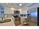 Modern kitchen with stainless steel appliances and white cabinetry at 4139 S Atlantic Ave # B204, New Smyrna Beach, FL 32169