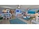 Open living room and dining area with coastal decor at 4139 S Atlantic Ave # B204, New Smyrna Beach, FL 32169