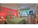 Bedroom with coastal decor and ceiling fan at 4139 S Atlantic Ave # B204, New Smyrna Beach, FL 32169
