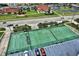 Aerial view of tennis and shuffleboard courts at 4139 S Atlantic Ave # B204, New Smyrna Beach, FL 32169
