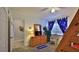 Bedroom with a dresser, TV, and access to another room at 4139 S Atlantic Ave # B204, New Smyrna Beach, FL 32169