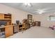 Home office with built-in desk and shelving at 299 W Hickory Ave, Oak Hill, FL 32759