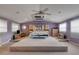 Spacious main bedroom with high ceilings and a large bed at 299 W Hickory Ave, Oak Hill, FL 32759