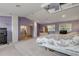Main bedroom with a large bed and access to the bathroom at 299 W Hickory Ave, Oak Hill, FL 32759