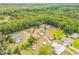 Single Gathering home surrounded by lush greenery at 299 W Hickory Ave, Oak Hill, FL 32759