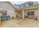 Spacious patio with seating area, adjacent to the house and pool at 299 W Hickory Ave, Oak Hill, FL 32759