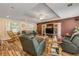 Spacious living room with hardwood floors, a media center, and comfortable seating at 299 W Hickory Ave, Oak Hill, FL 32759