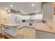Bright kitchen featuring white appliances and ample counter space at 299 W Hickory Ave, Oak Hill, FL 32759