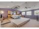 Spacious main bedroom with high ceilings and a large bed at 299 W Hickory Ave, Oak Hill, FL 32759