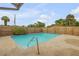 Refreshing rectangular pool with a wooden fence surround at 299 W Hickory Ave, Oak Hill, FL 32759