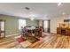 Dining room with hardwood floors, chandelier, and seating for eight at 299 W Hickory Ave, Oak Hill, FL 32759