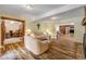 Living room with hardwood floors, fireplace, and access to office at 299 W Hickory Ave, Oak Hill, FL 32759