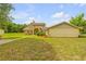 Two story home with a brick facade and walkway at 299 W Hickory Ave, Oak Hill, FL 32759