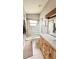 Updated bathroom with glass block shower and new vanity at 790 Pine Shores Cir, New Smyrna Beach, FL 32168