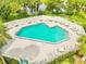 Inviting community pool with ample deck space for lounging at 790 Pine Shores Cir, New Smyrna Beach, FL 32168