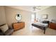 Comfortable bedroom with dresser and window with natural light at 790 Pine Shores Cir, New Smyrna Beach, FL 32168