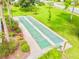 Community shuffleboard courts nestled in a landscaped area at 790 Pine Shores Cir, New Smyrna Beach, FL 32168